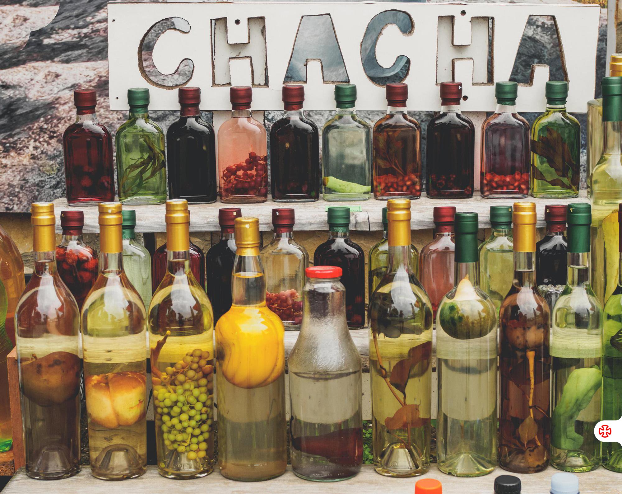 Bottles of Georgian chacha infused with fruits and herbs