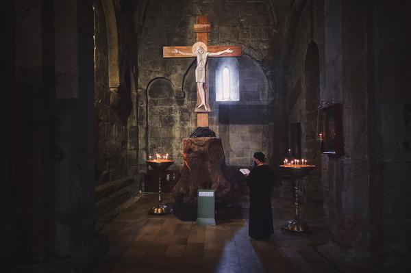 Praying Priest in Svetitskhoveli Cathedral in Mtskheta