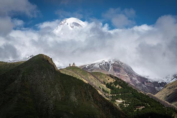 Dramatic View of Gergeti Church with a Mt Kazbek in the background