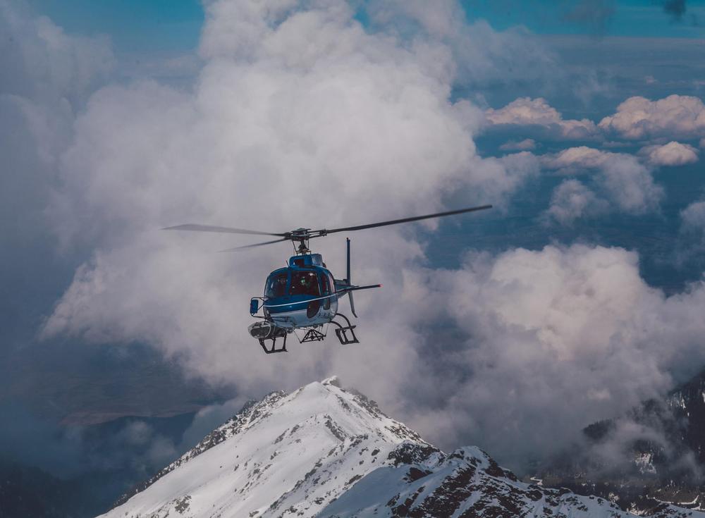 Experience Georgia's majestic peaks from the sky on an exclusive day trip with lunch included