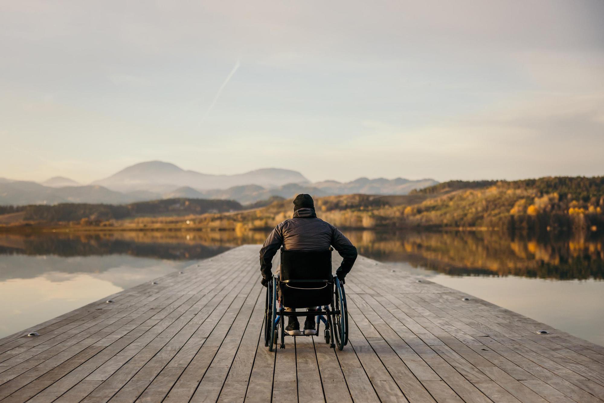 Man in a Wheelchair by a Lake