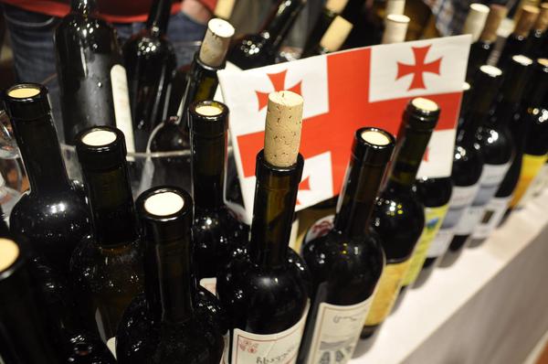 Bottles of Georgian Wine With a Flag of Georgia