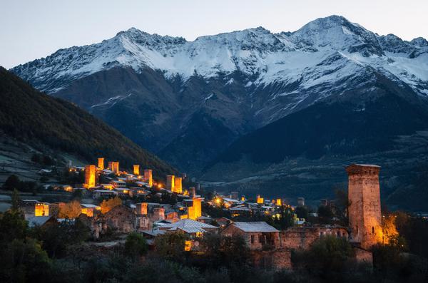 Mestia Evening with Illuminated Towers, Caucasus on the Background